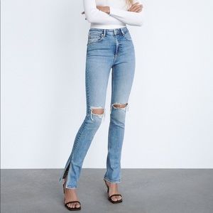 Size US 4 Zara hi-rise slim flare jeans with split hem in medium blue denim.